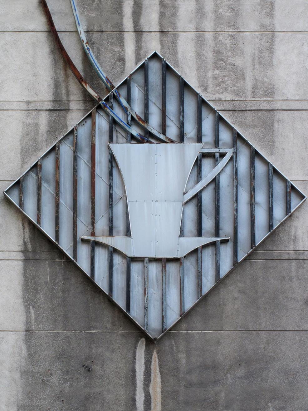 Logo on the facade of the abandoned Haus der Statistik, Berlin-Mitte
