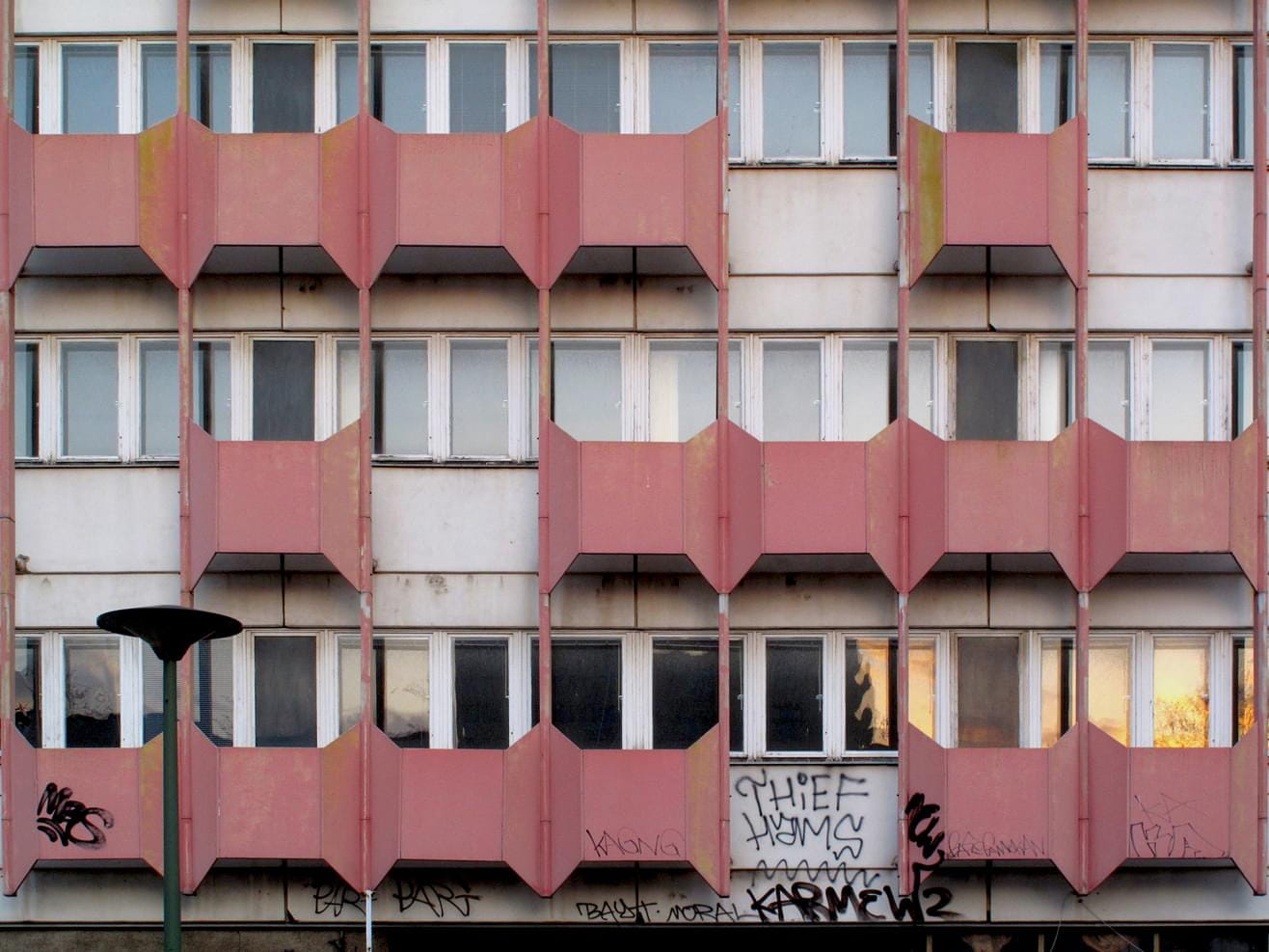 Red-grey facade of the abandoned Haus der Statistik, Berlin-Mitte