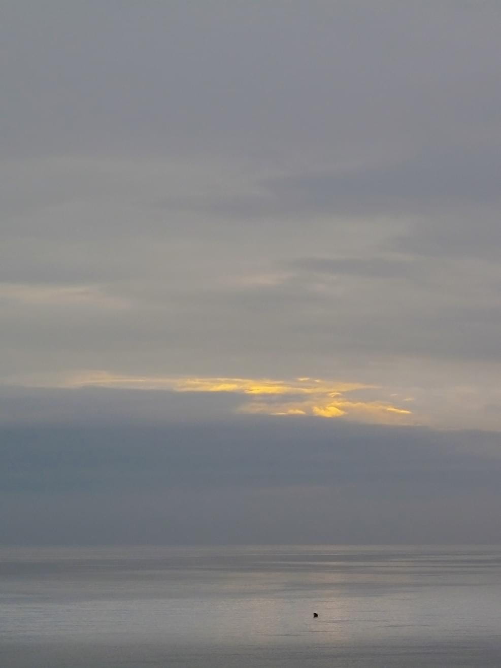 Smooth colours with a cloudy sunset on a beach in Spain