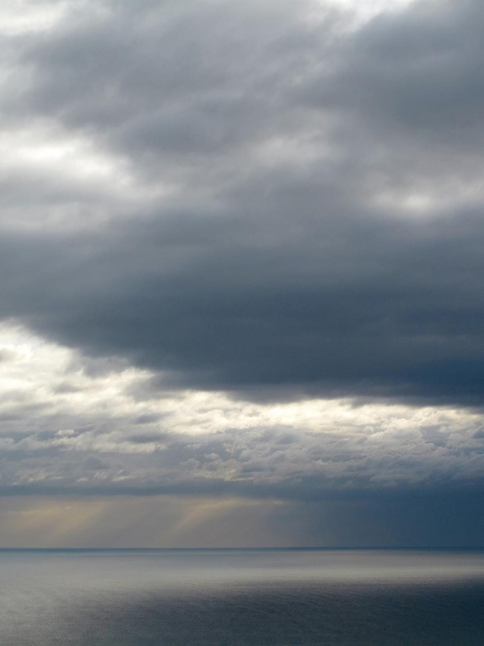 Sea view from the top with dramatic clouds in Spain