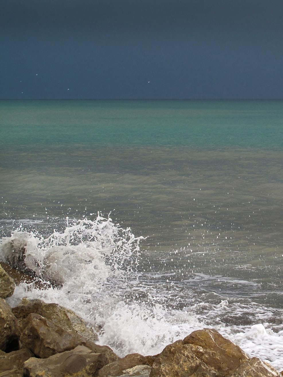 A dark sky and waves before a tempest at the mediterranean spanish coast